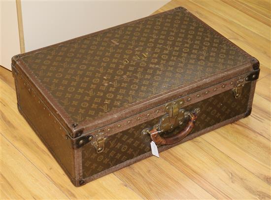 A Louis Vuitton suitcase, serial no. 809790, the lock stamped 076093, initialled JNP